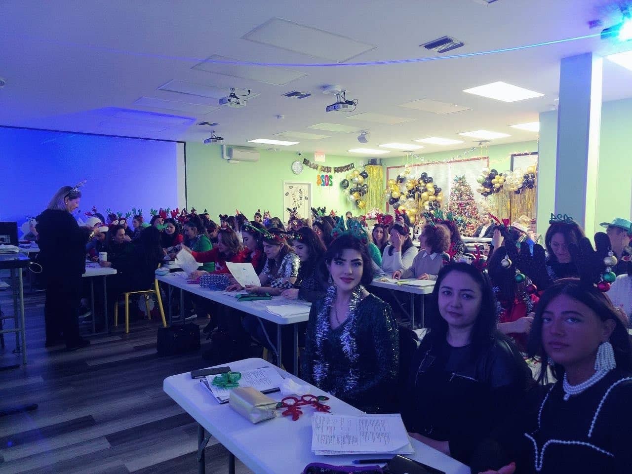 A full classroom of students at a holiday gathering of the NCLEX prep community